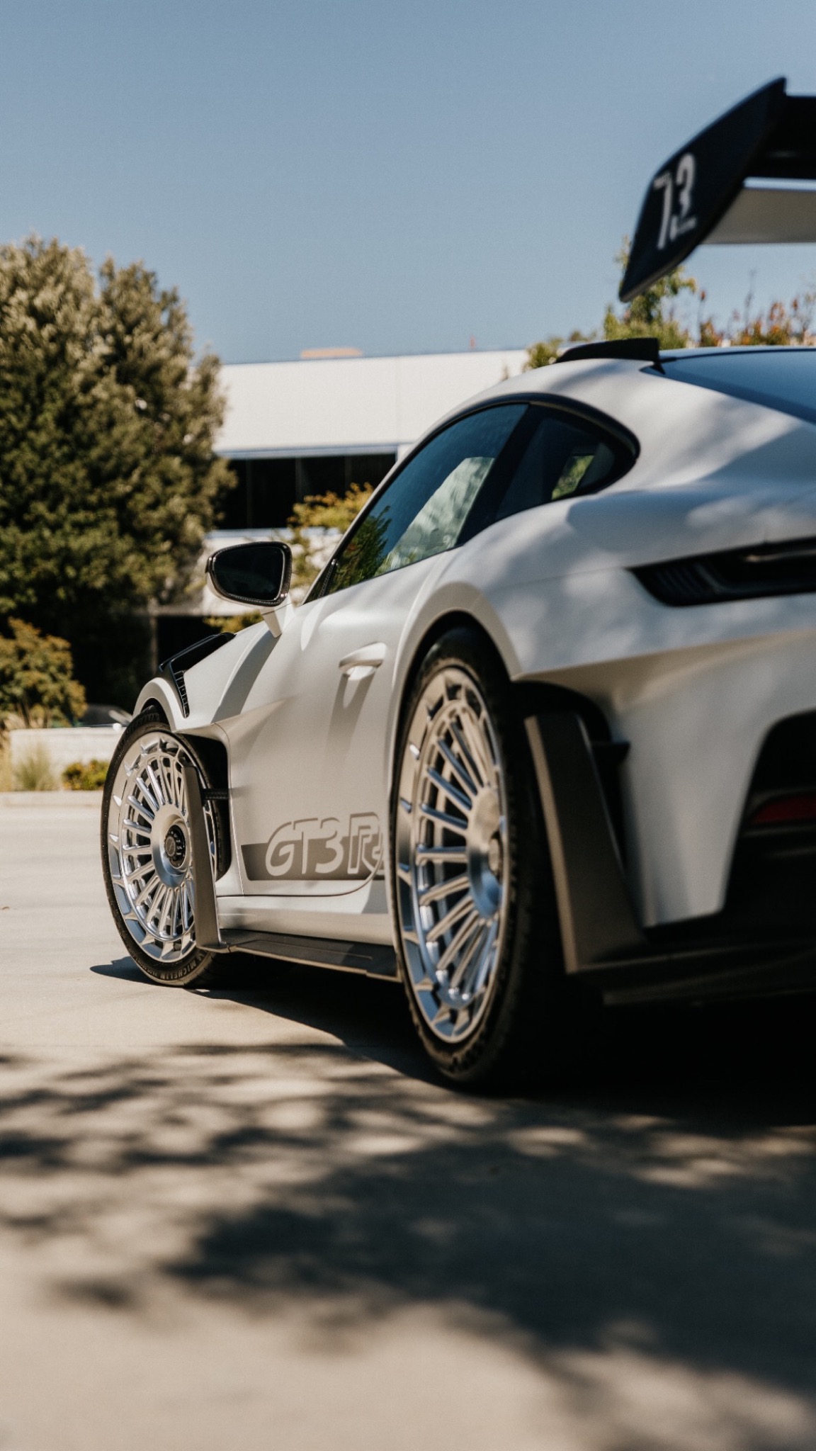 Close view of silver wheels and fitment on a white Porsche GT3 RS
